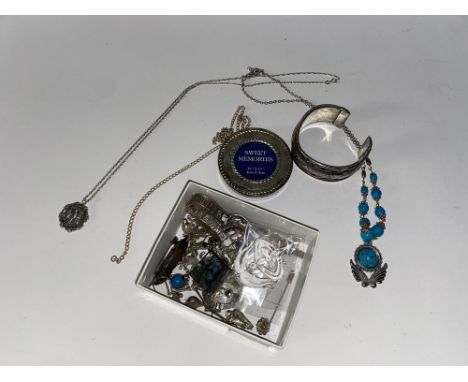 An assorted selection of white metal and silver jewellery, including a silver hallmarked cricket pendant on chain