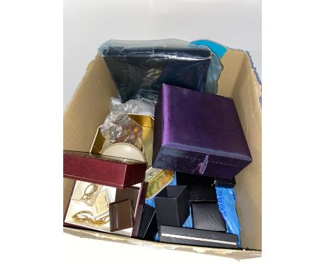 A box of assorted costume jewellery including faux pearls, gold coloured jewellery and watches