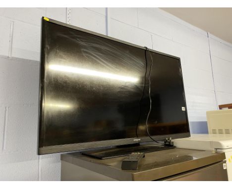 A Polaroid 42" flat screen television, with remote