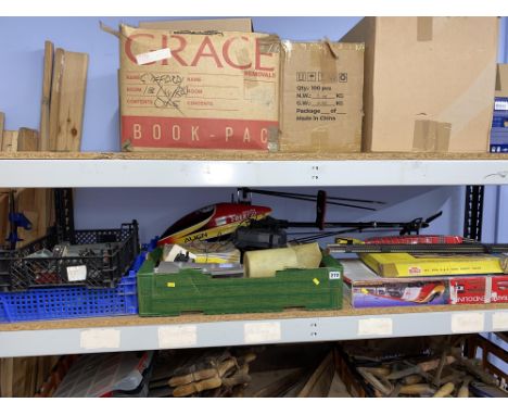 Shelf of vintage toys, Nitro Pro Trex 600 helicopter, trains etc