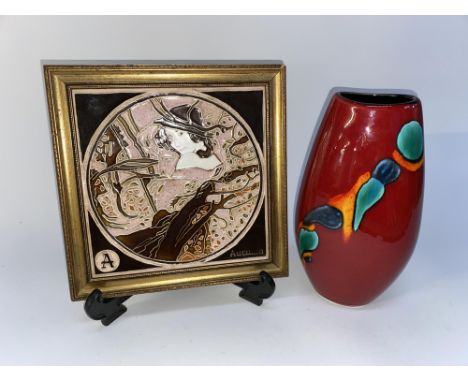 A Poole pottery vase of ovoid form and a decorative tube lined porcelain plaque, in gilt frame