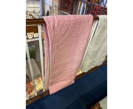 A pale pink and light cream handstitched Durham quilt and a white handstitched Durham quilt (2)