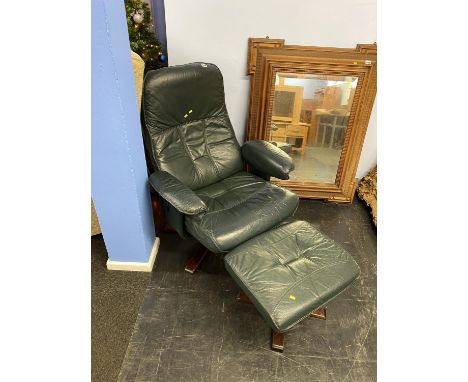 A Unico green leather armchair and foot stool