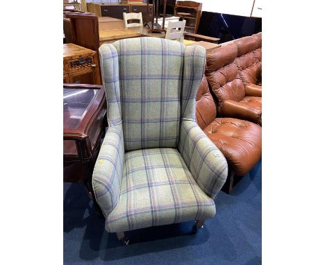 An as new tartan upholstered armchair