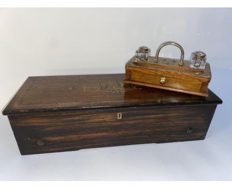 A Victorian inlaid part music box, lacking mechanism, 60cm L and an Edwardian oak desk stand