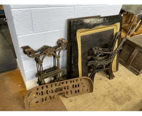 A cast iron and gilt painted fire surround, bench ends, tractor seat and other metalware