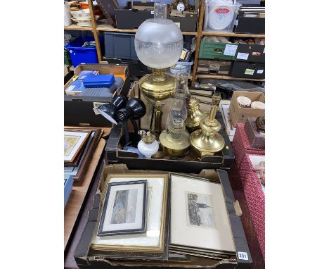 Two boxes of brass items, oil lamp, scales etc and a box of pictures, various artists