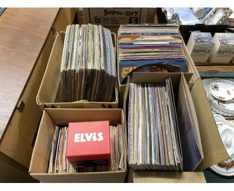 Four boxes of various LP records and 45s, of mixed genres, including Elvis Presley records