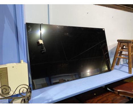 An LG wall mounted television, 55" screen, model OLED55B8SLC