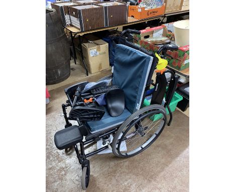 A Soma folding wheel chair, with seat and back pads