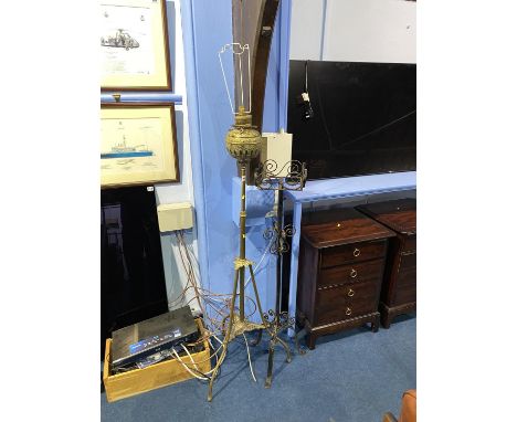 A brass telescopic lamp and a metal torchere