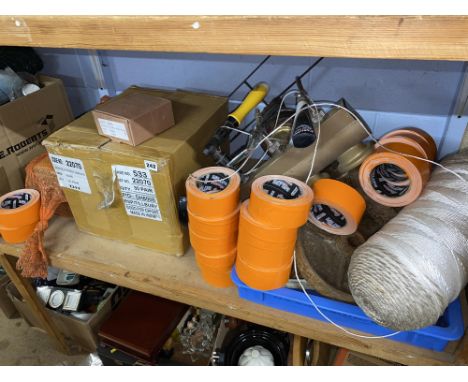 Shelf of assorted, duct tape, rope etc