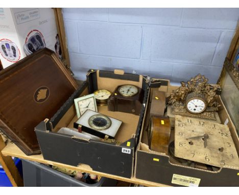 Shelf of clocks and a wooden serving tray