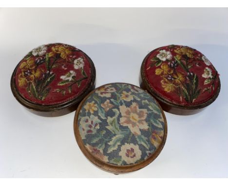 Three circular Victorian foot stools with tapestry worked tops, each with a diameter of 27cm