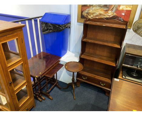 A reproduction bookcase, wine table and a nest of tables