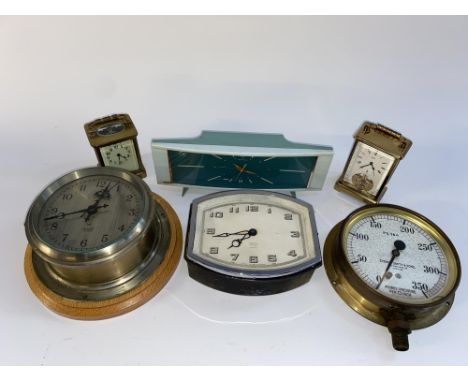 A 19th/20th Century French brass carriage clock with four sided glass case, 10cm H and four later clocks, plus a Sydney Smith