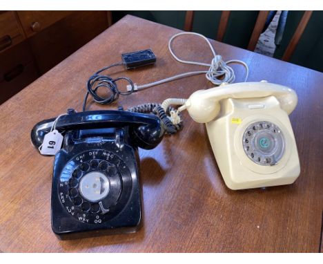 Two vintage Bakelite rotary dial telephones