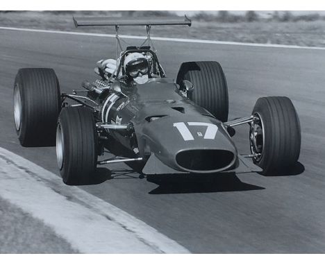 Derek Bell MBE Photograph & Lunch  Black and white photograph of Derek Bell MBE taking Old Hall Corner at the August 1968 Oul