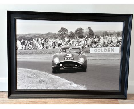 'Jim Clark in the Aston Martin DB4GT Zagato'  A large format true-photographic monochrome print depicting the World Champion 