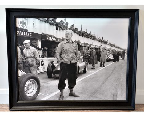 Mike Hawthorn at Silverstone, 1956'A large format true-photographic monochrome print depicting a pensive Hawthorn standing in