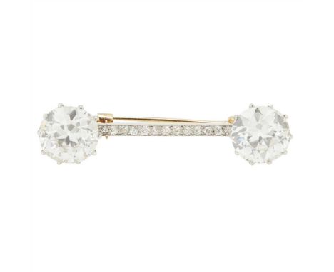 A diamond bar brooch claw set to each side with two old European cut diamonds with a pavé set diamond baton between, with acc