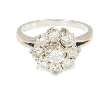 A diamond cluster ring formed as a cluster of nine round brilliant cut diamonds, the plain tapering shank stamped '10ct' (Dim