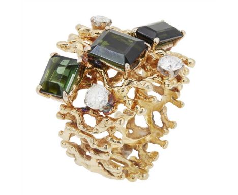 A 1960s/1970s tourmaline and diamond set ring claw-set with three emerald cut green tourmalines and three round brilliant cut