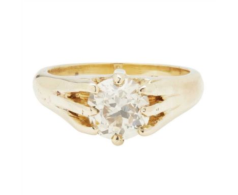 A diamond solitaire ring claw set with a fancy light brown old cut diamond, to a plain tapering shank, with accompanying repo