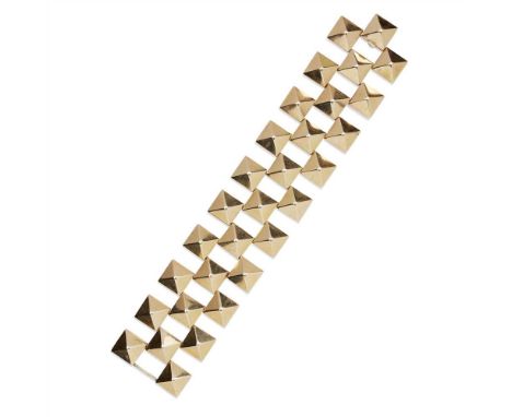 A gold studded bracelet formed as a triple row of square suds to a hinged, concealed clasp, stamped '14K' and with French mar