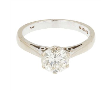 A diamond solitaire ring claw set with a round brilliant cut diamond, the plain tapering shank with British hallmarks for Lon
