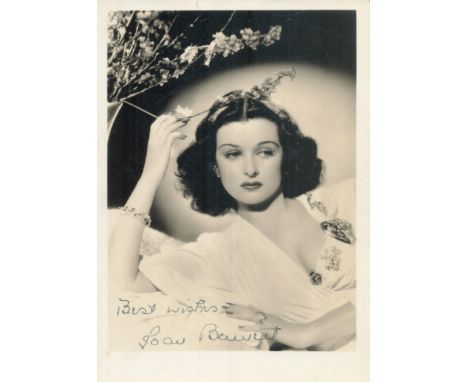 Joan Bennett signed 7x5inch vintage photo. Good condition. All autographs come with a Certificate of Authenticity. We combine