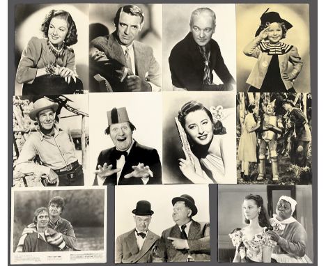 Entertainment unsigned vintage black and white 10x8 inch photo collection includes Laurel and Hardy, Ann Sheridan, Cary Grant