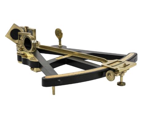 A 19th century ebony and brass octant. The central panel reads Owen Owens Liverpool, length 31cm.