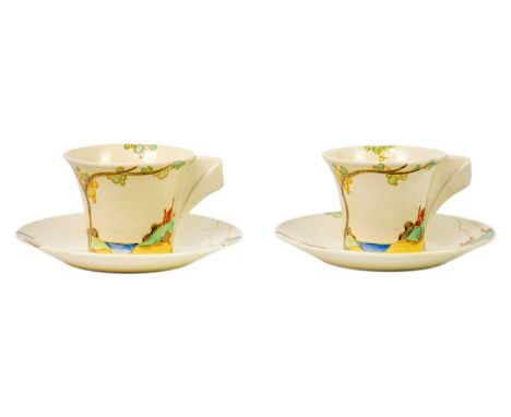 A pair of Clarice Cliff Secrets pattern Daffodil shape tea cups and saucers. Bizarre Newport Pottery marks.
