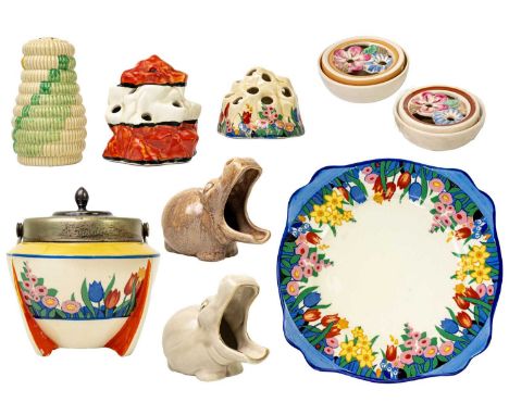 A collection of various Clarice Cliff. Including a Raffia sugar sifter, two Mr Hippo pipe rests, a Chloris pattern preserve p