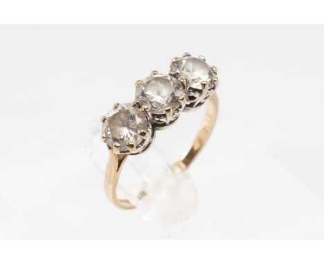 9CT GOLD THREE-STONE DIAMOND SIMULANT RING, the stones claw-set in white to a yellow shank