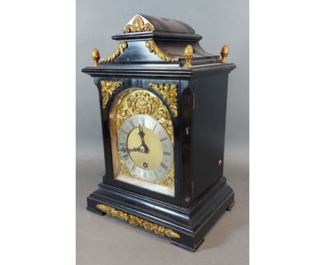 An early 20th Century ebonised and brass mounted bracket clock, the brass dial with silvered chapter ring inscribed J.W. Bens