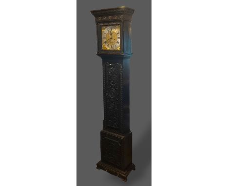 An oak longcase clock, the square hood above a shaped door raised upon ogee bracket feet, the brass dial inscribed Richard Co