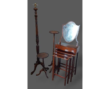 A mahogany lamp standard together with a mahogany torchere, a similar wine table, a nest of three tables and a swing frame to