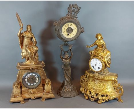 A 19th Century French gilded Spelter mantle clock together with two other similar Spelter mantle clocks 