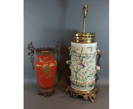 A Victorian pottery and gilt metal mounted table lamp, 60cms tall together with a similar two handled vase 