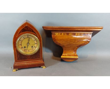 An Edwardian mahogany lancet shaped bracket clock, 27cms tall, together with a mahogany wall bracket, 