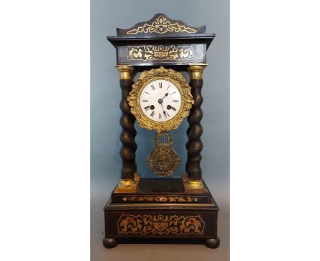 A 19th Century French ebonised and brass inlaid Portico clock, the enamel dial with Roman numerals and with two train movemen