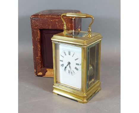 A 19th Century French brass Carriage clock with lever escapement and leather carrying case 
