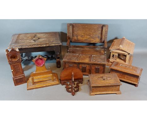 A miniature oak monks bench together with a similar coffer, two pocket watch holders, a small stool and other items 