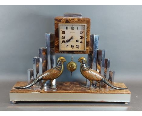 An Art Deco marble and stainless steel mantel clock mounted  with models of two pheasants, the dial inscribed Berrod, Bethune