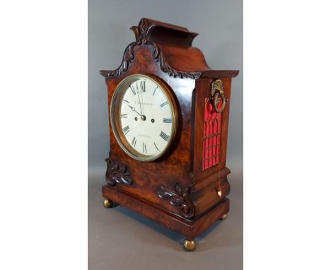 A William IV mahogany case bracket clock, the carved shaped case with side ring handles, the dial inscribed T. Whitehead, Lon