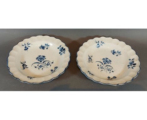 A pair of first period Worcester dishes of shaped outline decorated underglaze blue, blue Crescent mark to bases, 18.5cms dia