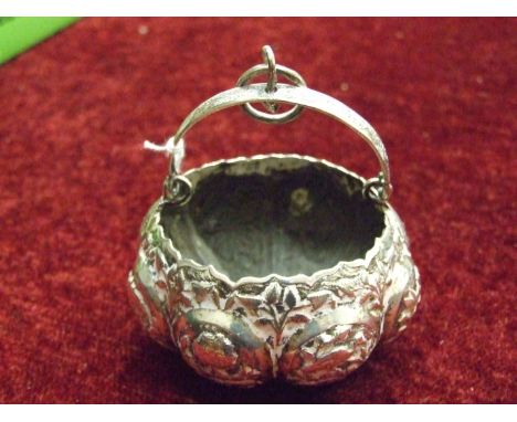 A cased engine-turned silver napkin ring, Birmingham 1941, ___1.3oz, (named) and an Asian white metal small hanging basket, 8