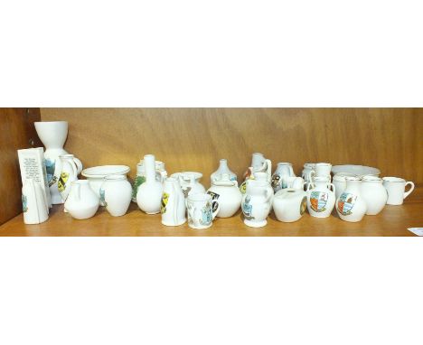 Approximately thirty-three pieces of W H Goss crested ware china.